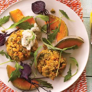 Herby quinoa savoury cakes with spicy dressing
