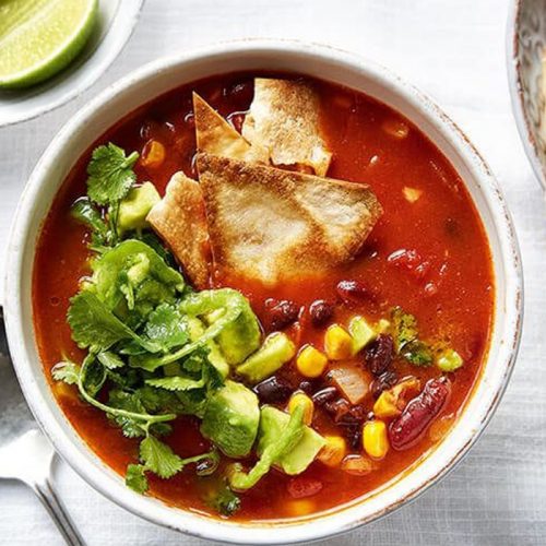 Mexican bean soup with salsa and tortilla chips